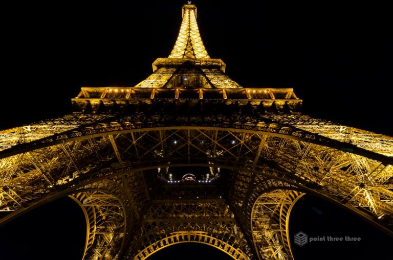 Eiffel Tower at night with lights on, Paris, France