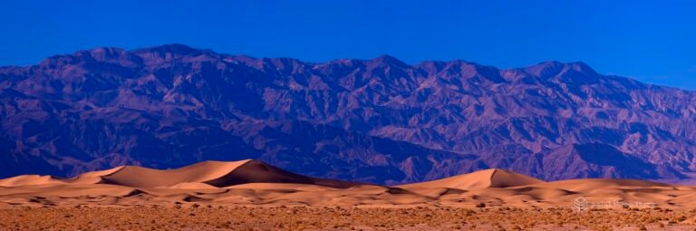 Mesquite Dunes in Death Valley National Park and mountains in the background.