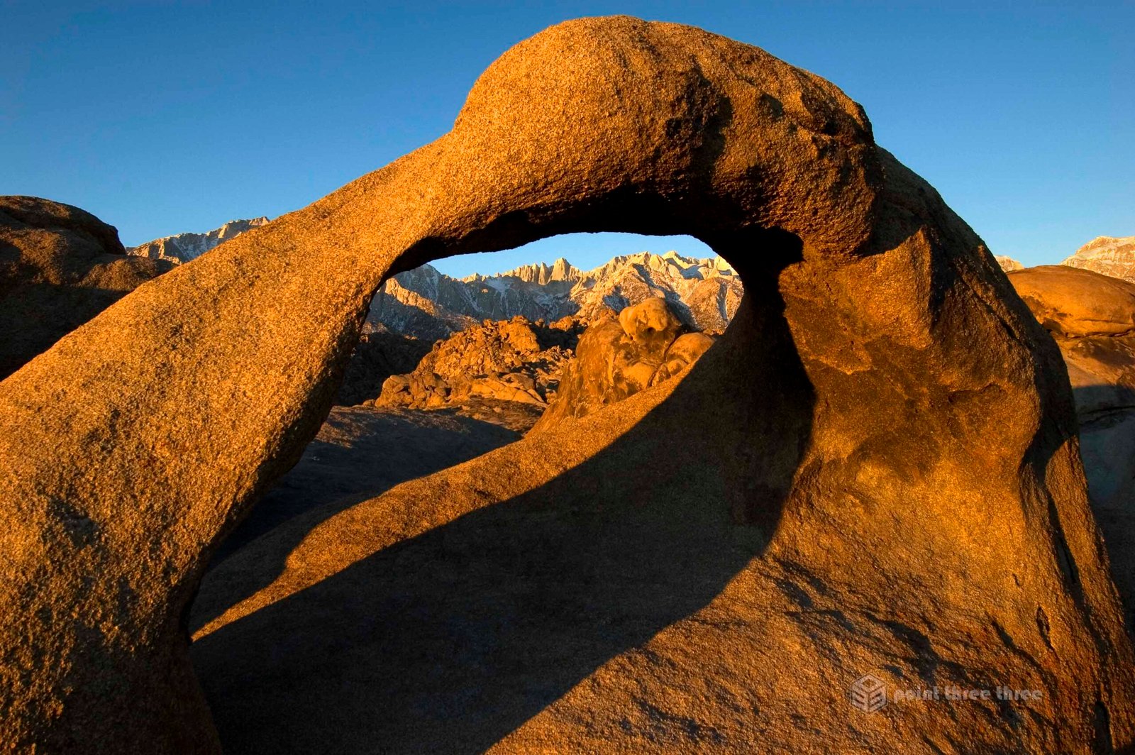 Sunrise at Mobius Arch with Mount Whitney in the Alabama Hills range.