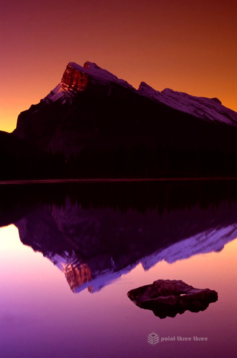 Sunrise at Mount Rundle Banff National park with lake in foreground