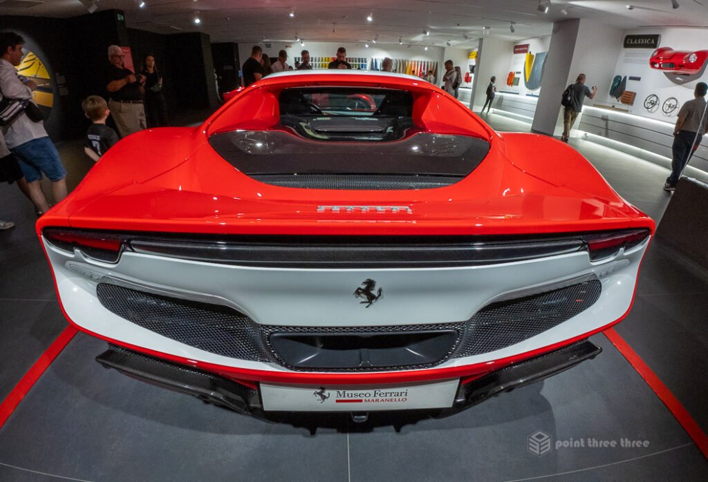 Rear view of the limited-edition Ferrari Daytona SP3 at the Maranello museum, highlighting its signature horizontal fins and retro-futuristic styling.