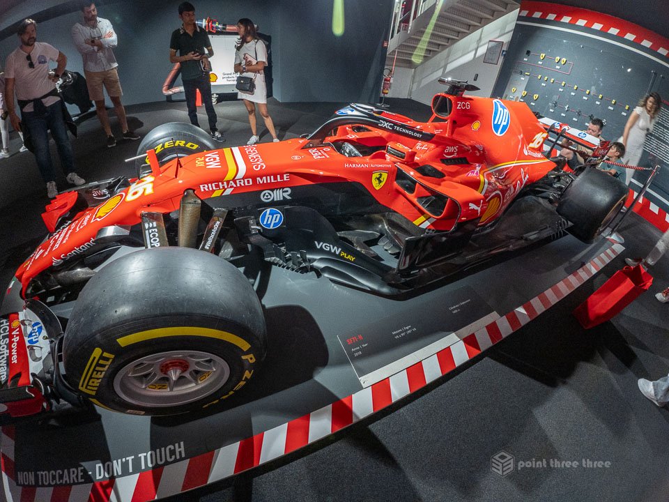 Ferrari SF71H Formula 1 racing car on display at the Museo Ferrari in Maranello, Italy, featuring the iconic red livery and Halo safety system.