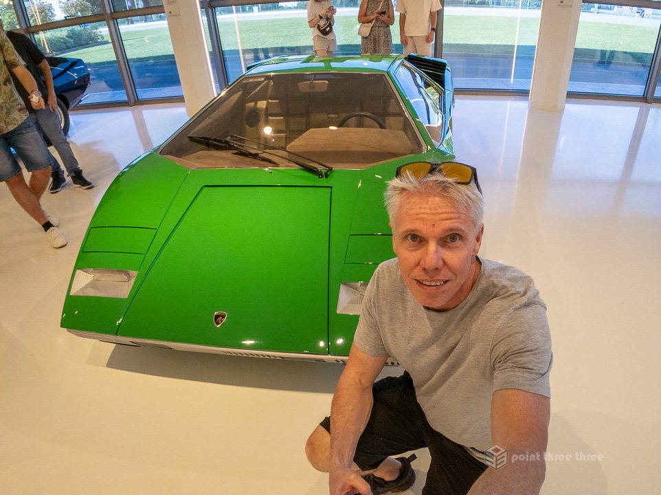Green Lamborghini Countach LP 400 prototype on display at the Lamborghini Museum in Sant'Agata Bolognese, featuring the iconic scissor doors and Marcello Gandini wedge design.