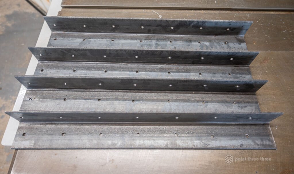 Steel frame Angle Iron - drilled holes to accept screws for wood fastening